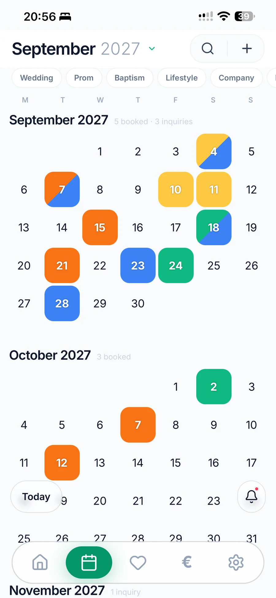 WeddingRunbook on iPhone: the season calendar, September and October 2027, bookings and inquiries colour-coded by event type